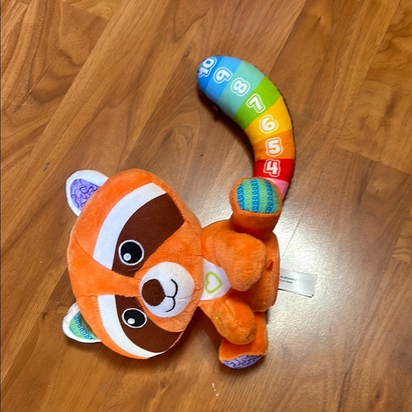 Orange and Blue Stuffed Raccoon Toy with Cartoonish Design - Picture 3 of 8